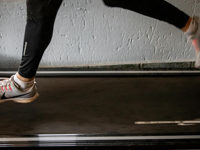 Abstract motion blur of a person running on treadmill.