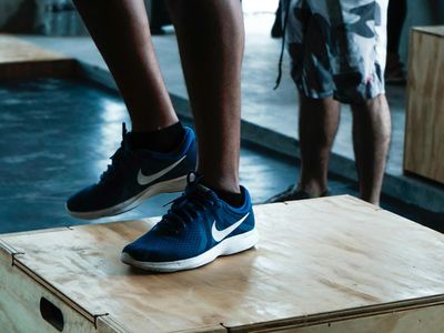 Close up of sports shoes stepping on a gym floor.